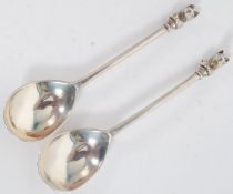 A pair of hallmarked silver salt spoons - hallmarked to the bowl, each spoon nicely decorated with a