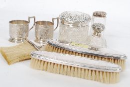 A collection of silver and silver plated dressing table items to include a hallmarked solid silver