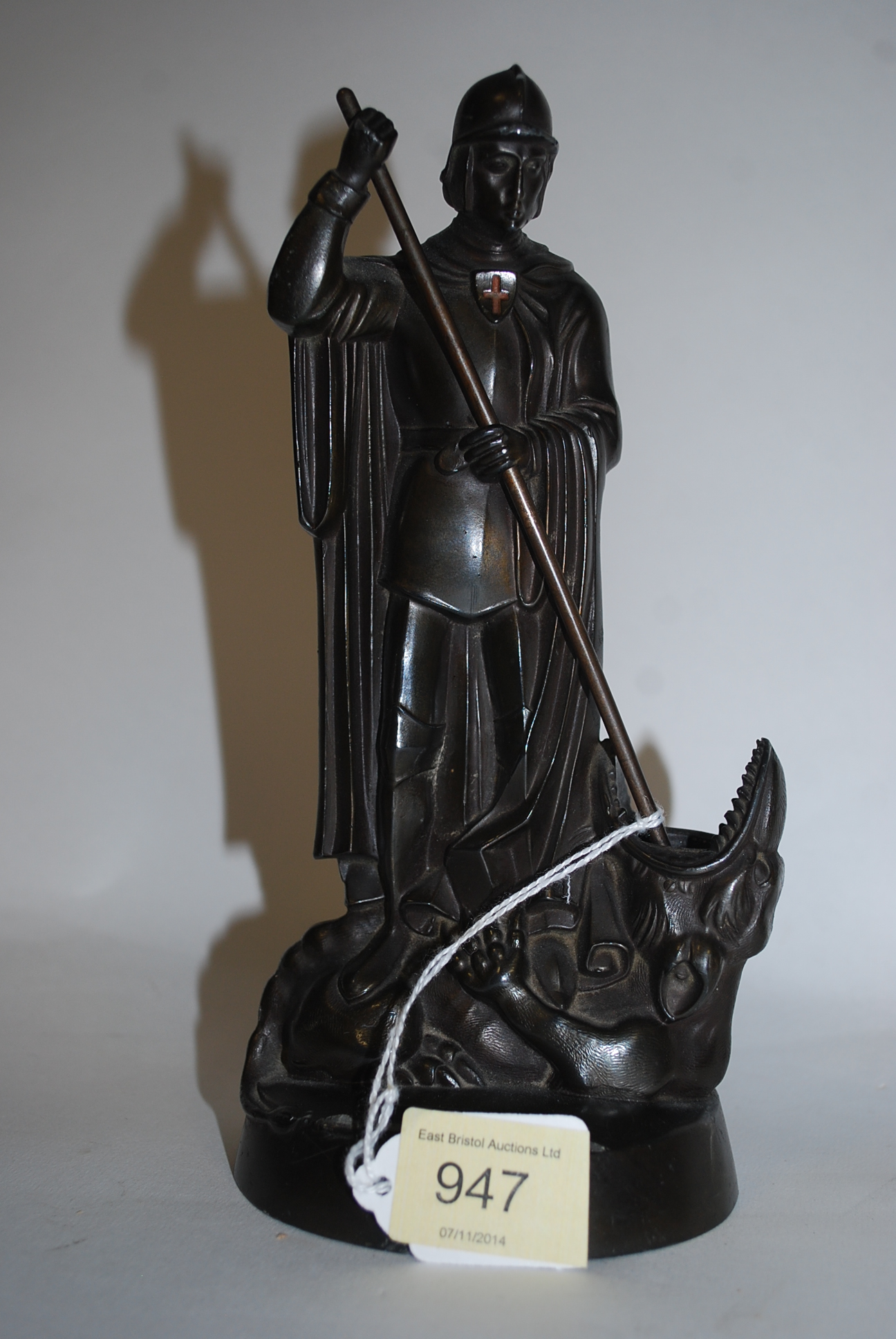 A good quality 20th century bronze figurine of St George & the Dragon being raised on bronze