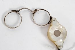A pair of 19th century Georgian silver and mother of pearl 19th century folding spectacles. Weight