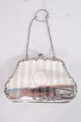 A hallmarked silver ladies purse, with lined interior. Clear hallmarks to front, with registration
