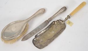 Two hallmarked silver items, dressing table brush, handled knife and silver plate crumb tray.