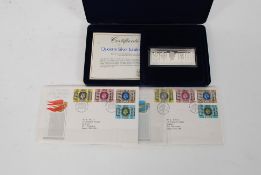 A boxed hallmarked silver ingot for the Queens Jubilee together with the official 1st day covers.
