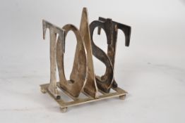 A vintage mid century toast rack. Being constructed  with silver plated letters forming the word