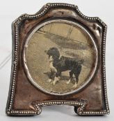 A hallmarked silver fronted miniature picture frame containing an original vintage photograph of a