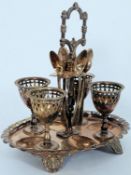 An early 20th century good quality 4 place silver plate egg server cruet set complete with spoons