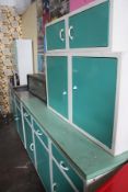 A 1950`s Art Deco complete kitchen  painted wooden two kitchen cabinets  by. The base with a series