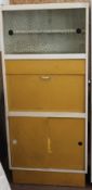 A vintage 1950`s painted wooden two tone kitchen dresser. Yellow painted drawers and cupboards with