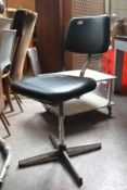A mid 20th century Industrial office / clerks metal swivel office chairs. Raised on a quadruped