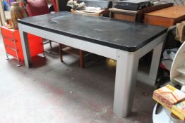 A 20th century Industrial large metal and ebonised wooden desk being raised on silvered metal frame