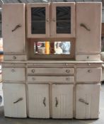 A 1930`s Art Deco painted wooden kitchen dresser. The base with a series of drawers and cupboard of
