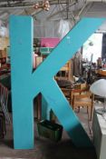 A very large letter ` K ` constructed and painted being of wood construction. Measures 200cms high