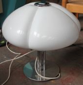 A Harvey Gazzini chromed metal table lamp, with domed, scalloped perspex shade. Measures 50cms high