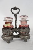 A decorative early 20th century pickle stand complete with two ruby / cranberry cut glass jars