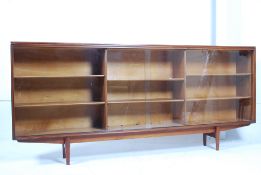 A 1960`s solid teak wood Danish large  library bookcase display cabinet in the manner of Niels