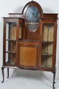 An Edwardian mahogany inlaid drop centre bookcase display cabinet.  Raised on cabriole legs with