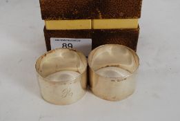 A pair of boxed hallmarked silver napkin rings 1.5 ounces the pair