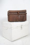 A large 19th century painted metal tin steamer trunk with painted finish complete with key to the