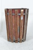 A pair of retro metal tubular framed stacking chairs along with a vintage wall hanging school bin