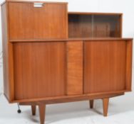 A 1970`s Danish teak wood Tambour fronted cabinet. Raised on tapered supports having tambour