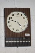 A retro 1970`s Seiko faux wood plastic striking transition wall clock.  H36cm x W24cm D8cm