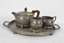 A 20th century pewter tea set comprising of pot, tray, creamer and bowl stamped Period Pewter.