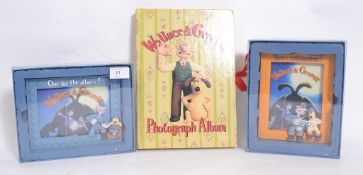 Two boxed Wallace & Gromit photograph frames and photo album. New.