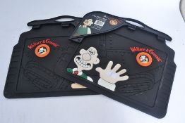 Two unused (with tags) Wallace & Gromit rubber car mats.