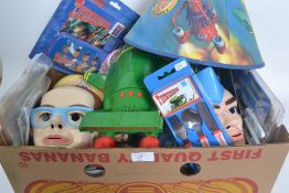 A box of Thunderbirds toys / items to include mask, lampshade, games etc.