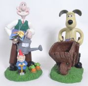 Two Wallace & Gromit garden statues - new, with tags.