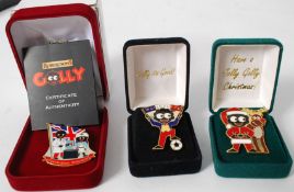 GOLLY: A collection of three Robertsons enamel Golly badges - each in original box, one with