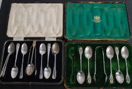 A cased set of hallmarked silver spoons and tongs bearing London hallmarks together with another set