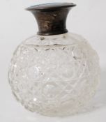 A silver hallmarked cut glass perfume bottle. The hallmarks for William Adams  Birmingham 1904.