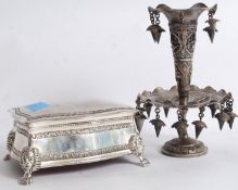 A Georgian style silver plated table top casket raised on lion paw feet with lion mask hips. Above a
