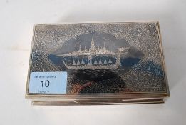 A silver sterling stamped desk top box with decorative scene to the lid. The interior being lined