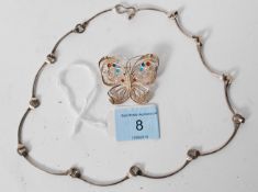 A 925 silver broach in the form of a butterfly weighing 5.4 grams along with a silver necklace