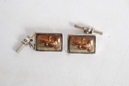 A pair of silver metal stamped 925 cuff links depicting Ducks