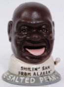 A 20th century cast iron 'Smiling Sam' money box bank - with hand painted detail