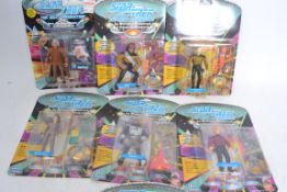 A collection of 7 Playmates Star Trek Next Generation carded action figures.