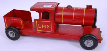 An early 20th century hand painted Triang Toys large tinplate red rail way train LMS on four