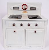 A vintage AMERSHAM TOYS 'made in England' early 20th century tinplate toy cooker / stove / oven with
