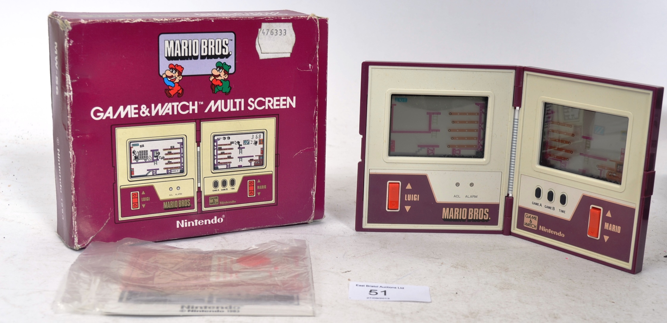 An original Nintendo Game & Watch Multiscreen Mario Bros handheld gaming console, complete with