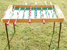 A retro ' Made in France ' table football game with four metal legs made of wood and plastic with