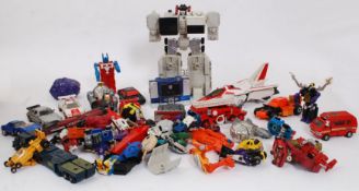 TRANSFORMERS: A collection of original 1980's Hasbro Transformers toys.
