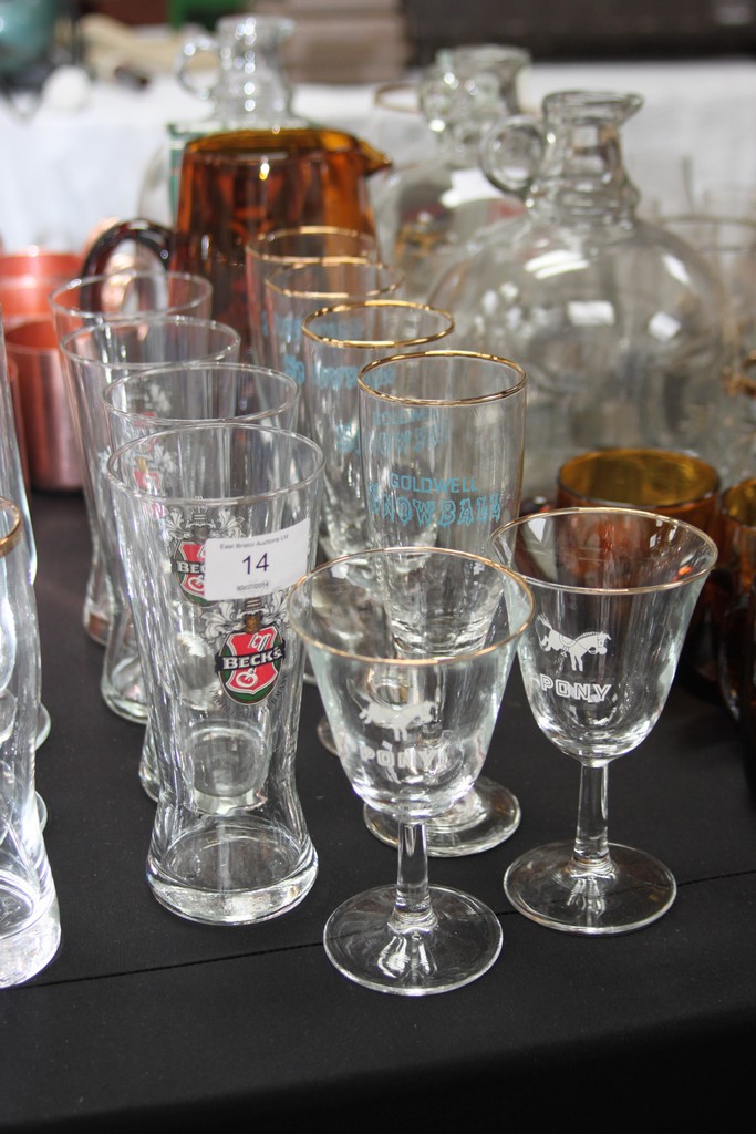 A collection of vintage pub glasses to include Goldwell Snowball, Becks and Pony