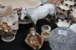 A Beswick grey dapple horse together with a monkey figurine and wildlife pots with lids