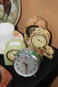 A collection of clocks to include mid 20th century rouge marble clock, alarm clocks etc