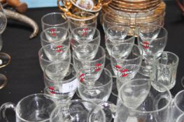 A collection of vintage pub glasses - Martini glasses, complete with notation