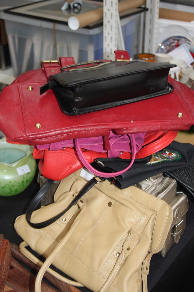 A large collection of ladies handbags from the 20th century to include leather etc