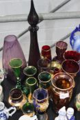 A  large collection of Bohemian type colourted glass wares to include vases etc. Green, Cranberry